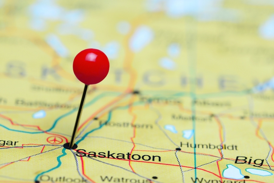 Photo of pinned Saskatoon on a map of Canada.